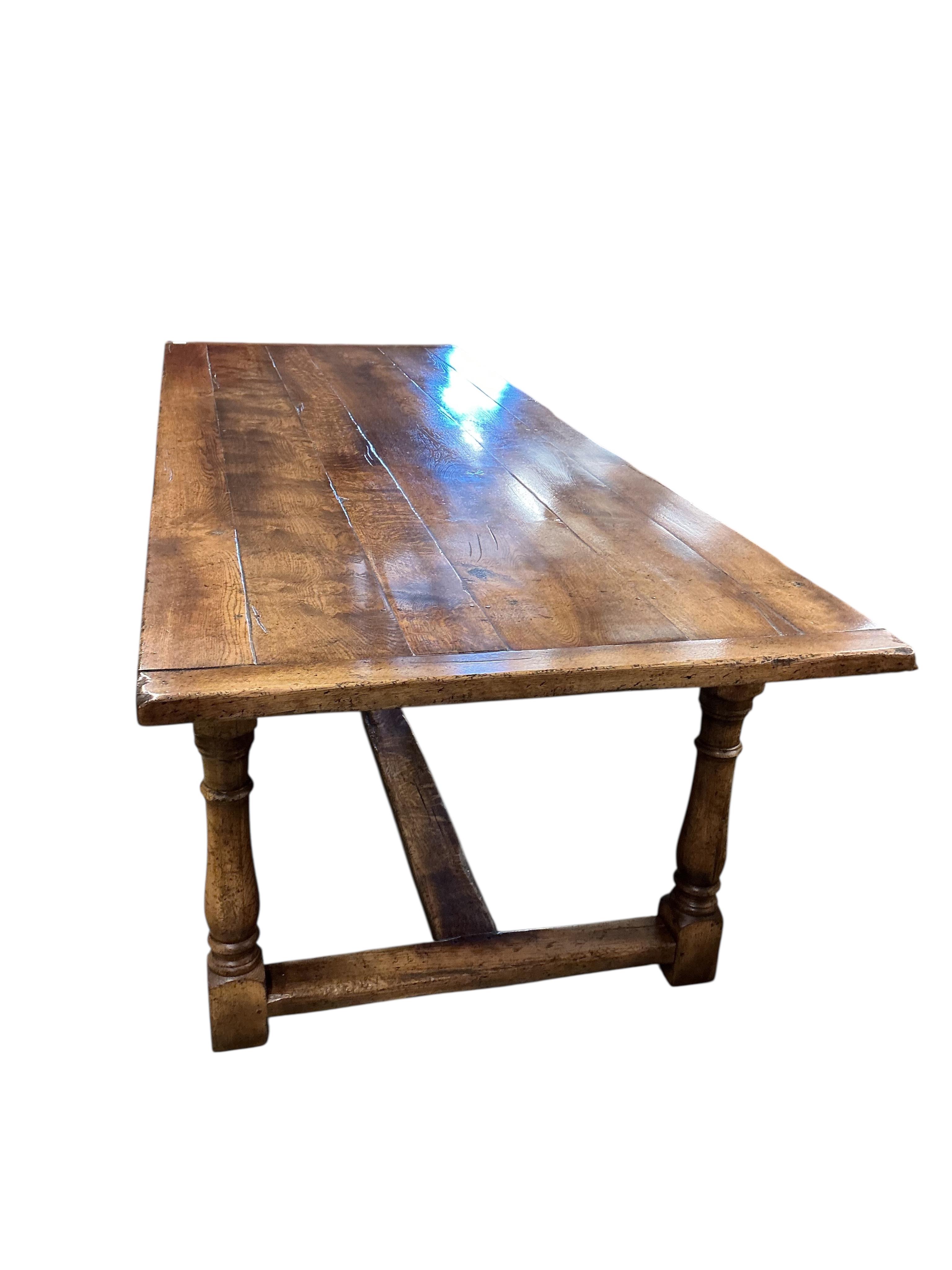 A 17th century style rectangular oak refectory dining table, with cleated six plank top, width 274cm, depth 102cm, height 79cm